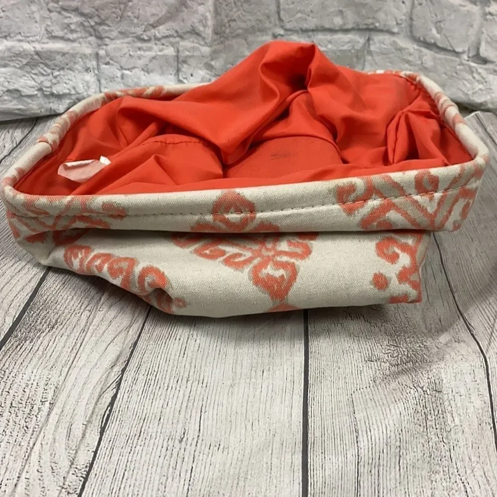 Collapsible print canvas covered storage cube with metal rim and side handles
